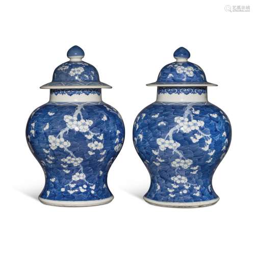 A pair of blue and white 'prunus' baluster jars and ...