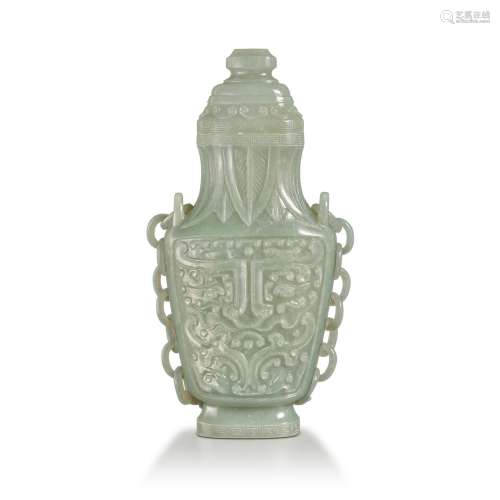 An archaistic celadon jade 'taotie' hanging vase and...