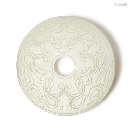 A carved pale celadon jade disc (Bi), 20th century | 二十世紀...