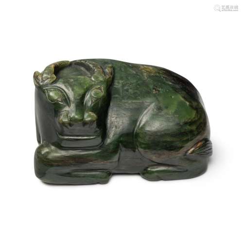 A large spinach-green jade carving of a recumbent water buff...