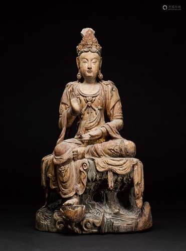 A large carved and polychrome wood seated figure of Avalokit...