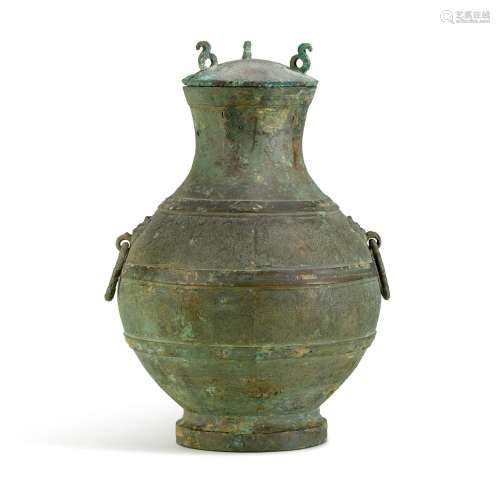 An archaic copper-inlaid bronze wine vessel, hu, Eastern Zho...