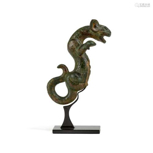A bronze 'feline' handle, Zhou dynasty | 周 青銅獸耳