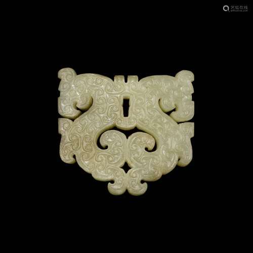 A reticulated celadon jade 'dragon' plaque, Eastern Zhou dyn...