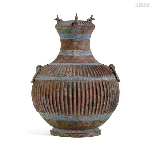 An unusual azurite-painted bronze ribbed vessel and cover, h...