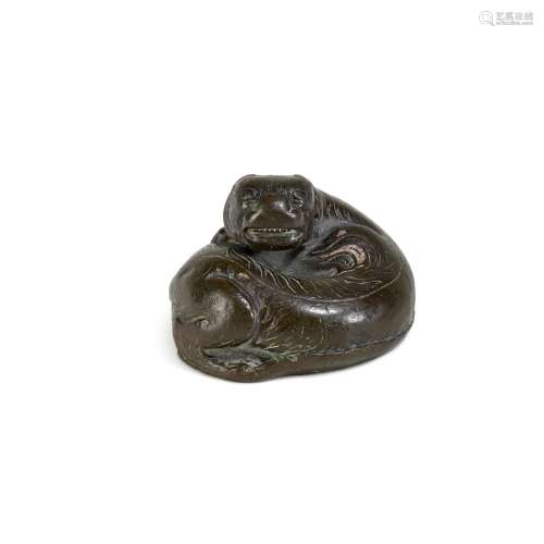 A silver-inlaid bronze 'tiger' weight, Han dynasty | 漢 銅錯...