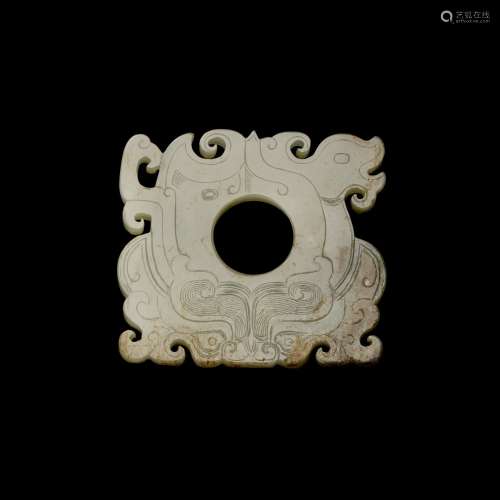 A jade 'animal mask' pendant, Han dynasty | 漢 獸面韘形紋玉珮