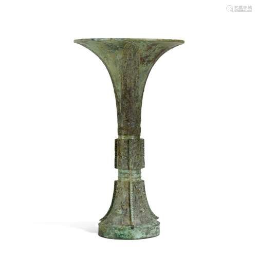 An inscribed archaic bronze ritual wine vessel, gu, Shang dy...