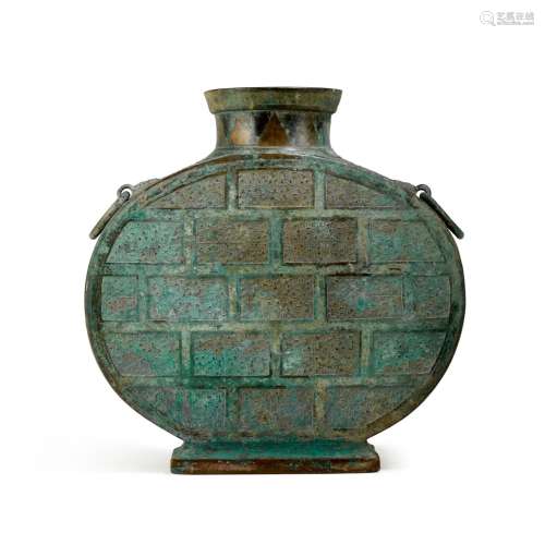 An archaic copper-inlaid bronze wine vessel, bianhu, Eastern...