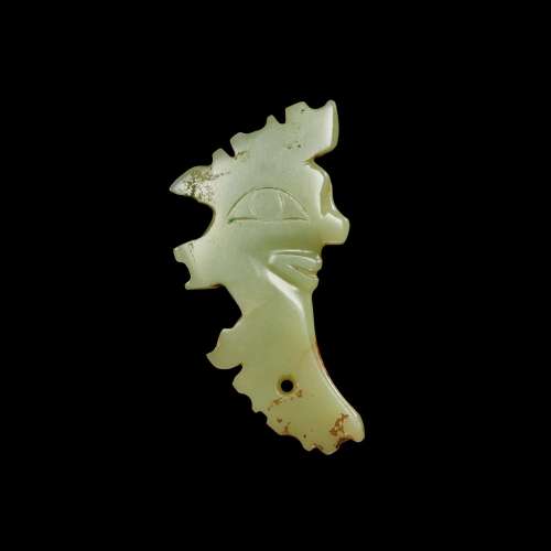 A yellow jade 'mask' ornament, Neolithic period, Shijiahe cu...