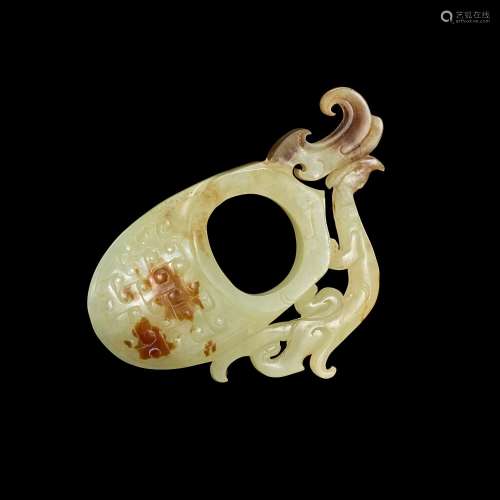 A pale celadon and russet jade 'archer’s ring' ornament, Wes...