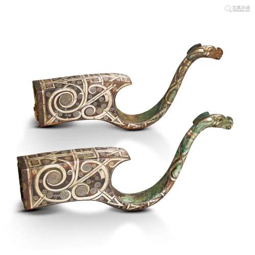 A pair of silver-inlaid bronze crossbow fittings, Eastern Zh...