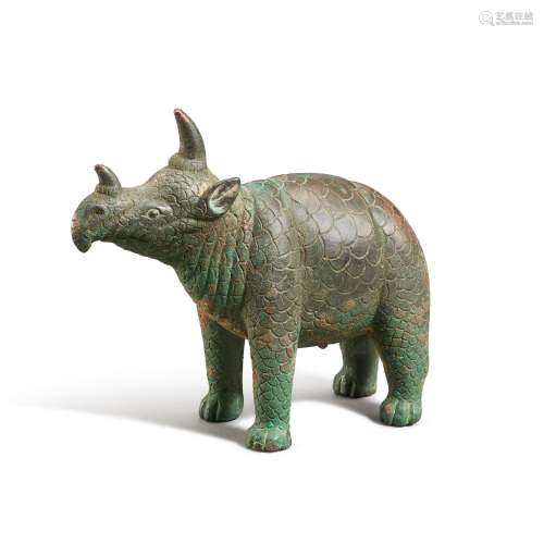 A rare small bronze figure of a rhinoceros, Tang dynasty | 唐...
