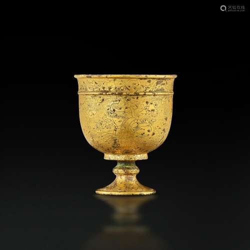 A small finely engraved gilt-bronze 'hunting' stem cup, Tang...