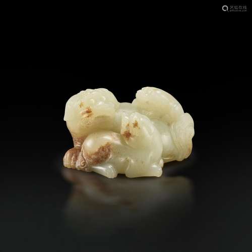 A white and russet jade 'Buddhist lion' group, Qing dynasty ...