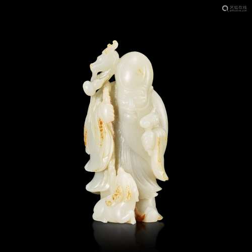A white and russet jade 'Shoulao and deer' group, Qing dynas...