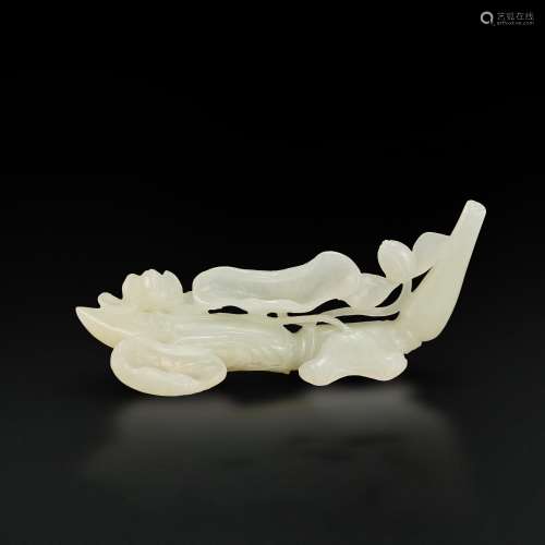 A white jade 'lotus root' brushrest, Qing dynasty, 18th cent...