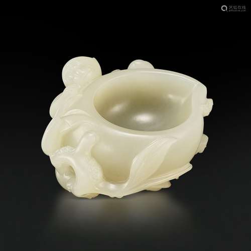 A white jade 'monkey and peach' washer, Qing dynasty, 18th c...