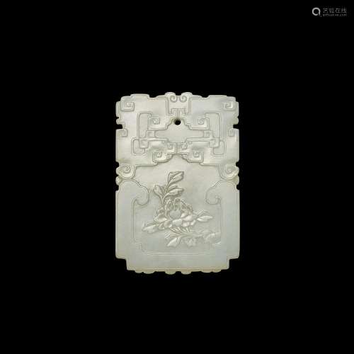 An inscribed white jade 'peony' plaque, Qing dynasty, 18th c...