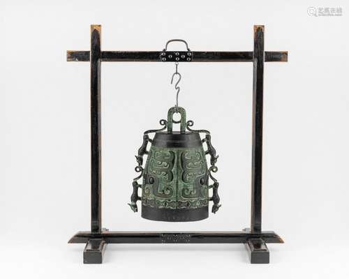 A Chinese bronze bell of archaic form, 14 in. (35.56 cm.)