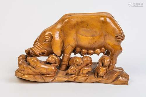 A carved wood sculpture of a pig and her piglets. 15 in. (38...