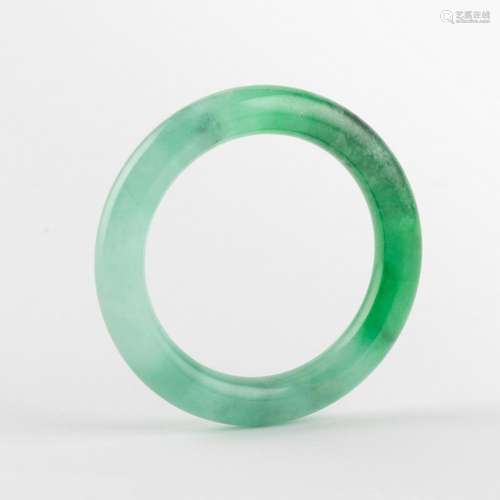 A Burmese icy jadeite lady s bangle. 2 1/4 in. (5.72 cm.) in...