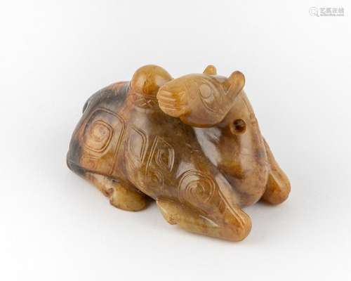 A mottled russet jadeite carving of a seated camel. 2 1/2 x ...