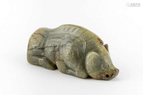 A mottled dark green and celadon jadeite carving of a boar. ...