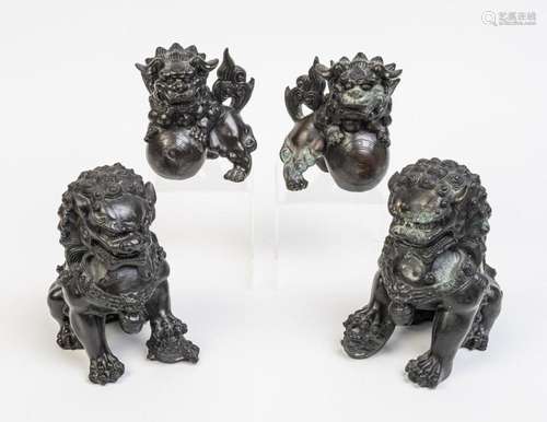 Two pairs of cast metal lion dogs,