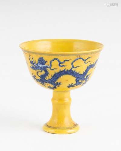 A Chinese yellow ground blue and white stem cup, 3 1/4 x 3 i...