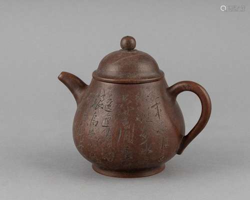 A Chinese purple clay teapot, 6 1/4 x 6 1/2 in. (15.88 x 16....