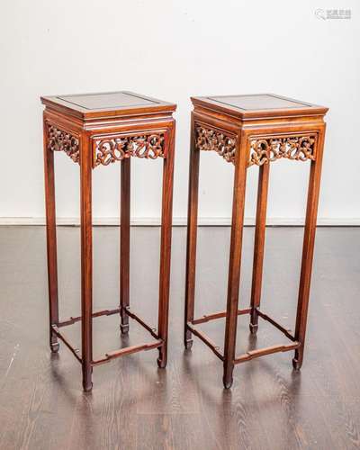 A pair of Chinese hardwood jardiniere stands with pierced fr...