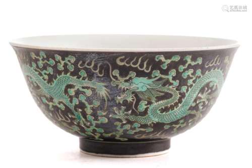 A Chinese porcelain dragon bowl, painted with three dragons ...