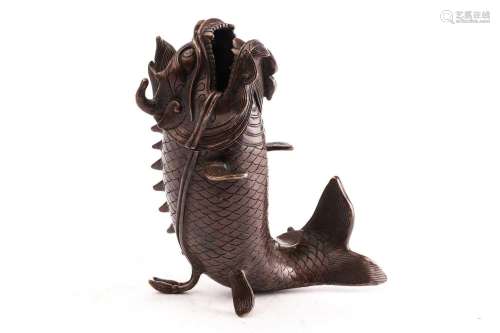 A Chinese bronze censor in the form of a leaping dragon carp...