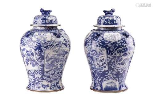 A pair of large Chinese style porcelain vases and covers, th...
