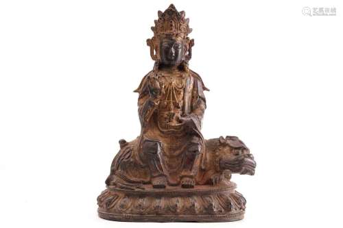 A Chinese bronze figure of Guanyin, in the Ming style, seate...