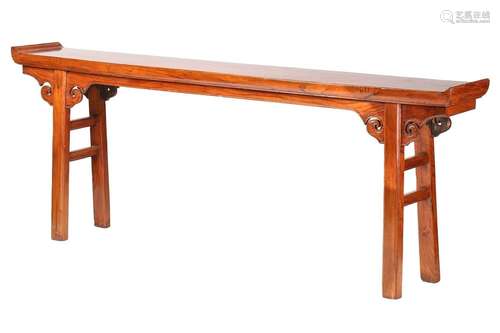 A Chinese elm altar table with everted ends, scroll frieze a...