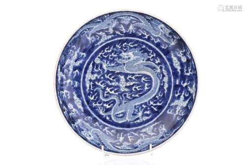 A Chinese porcel;ain blue & white dragon dish, painted w...