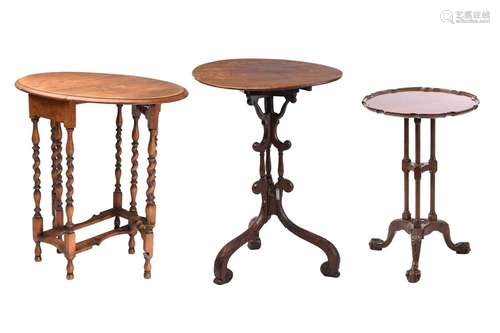 A George III and later mahogany tripod table with a plain ci...