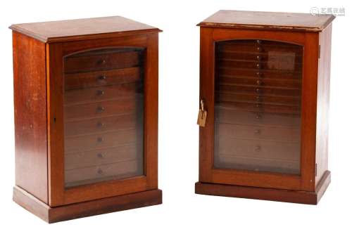 A pair of early 20th-century mahogany collectors cabinets ea...