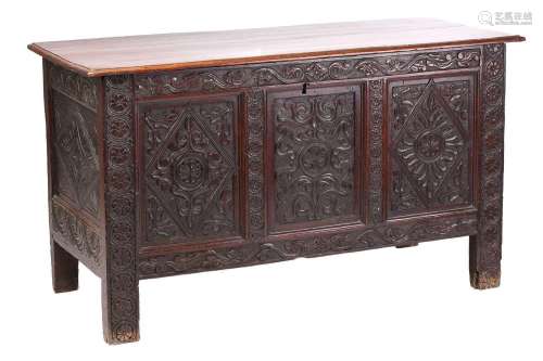A mid-17th century oak three-panel coffer, with a planked to...