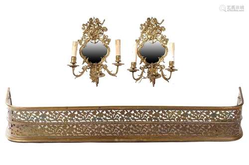 A pair of gilt brass three-sconce girandole with putti surmo...