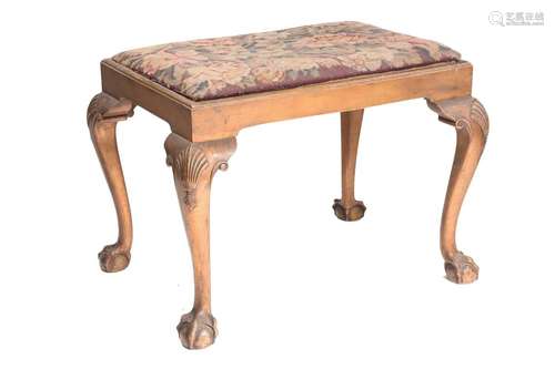 A George I style carved and gilt wood dressing stool, c1920s...