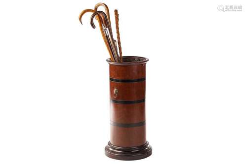 An Edwardian-turned mahogany cylindrical stick stand with mo...