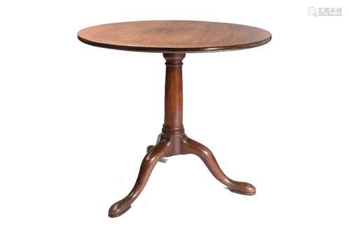 A George III mahogany circular flip-top wine table with a &q...