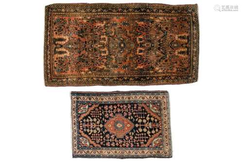 An old Sarouk rug with sprays of flowers on a pink ground wi...