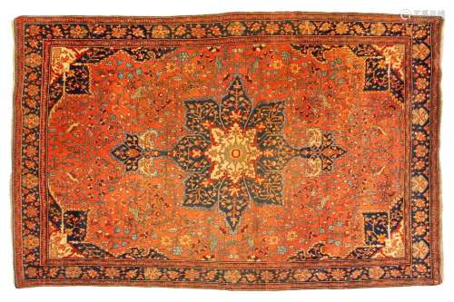 An old Tabriz rug with a central star motif with hanging lan...