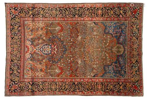 An old Motashemi Kashan rug with a flowering urn issuing fro...