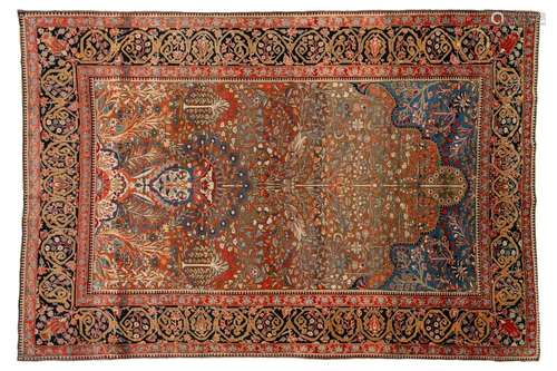 An old Motashemi Kashan rug with a flowering urn issuing fro...