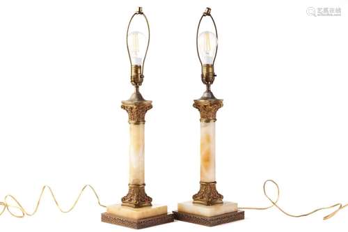 A pair of `Hollywood Regency` gilt metal and onyx Corinthian...